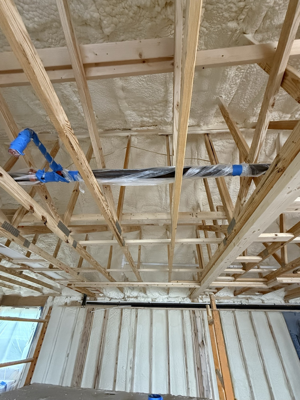 Foam around the framing at a corner.