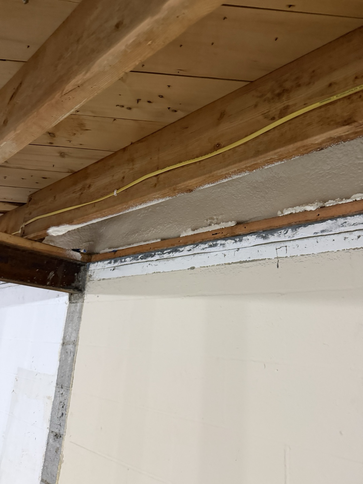Foam around a service penetration through the rim.