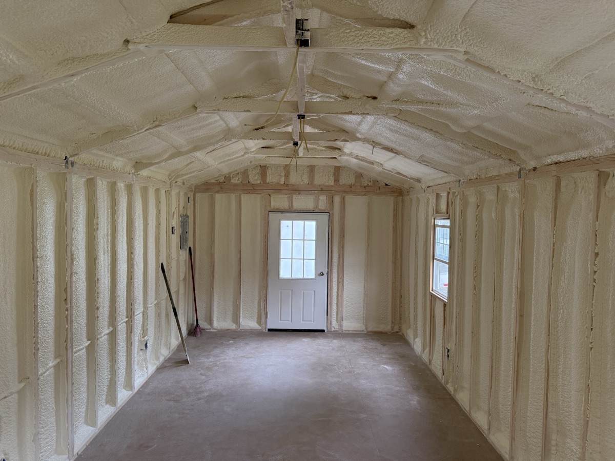 Foam between the rafters above the window.