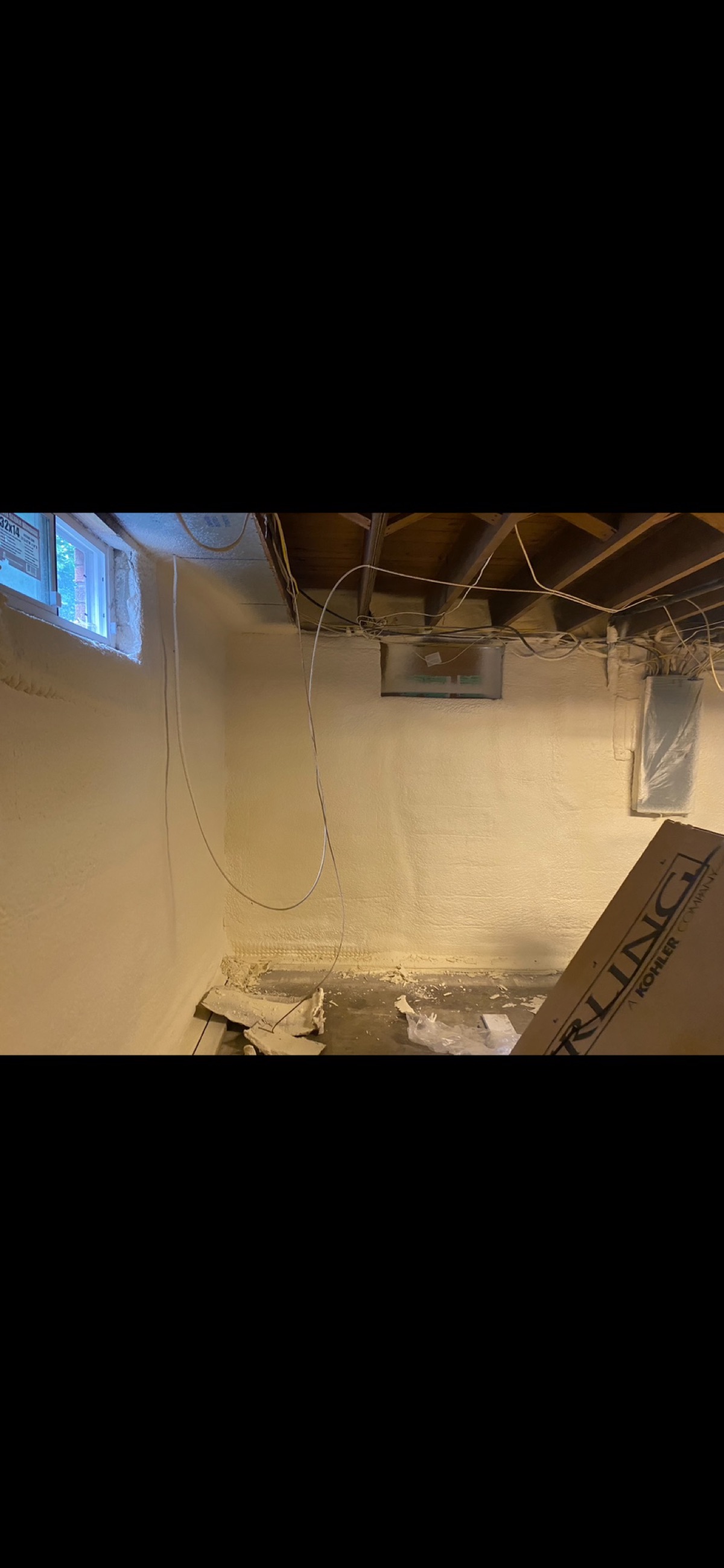 Foam worked around the panel and the wiring above it.