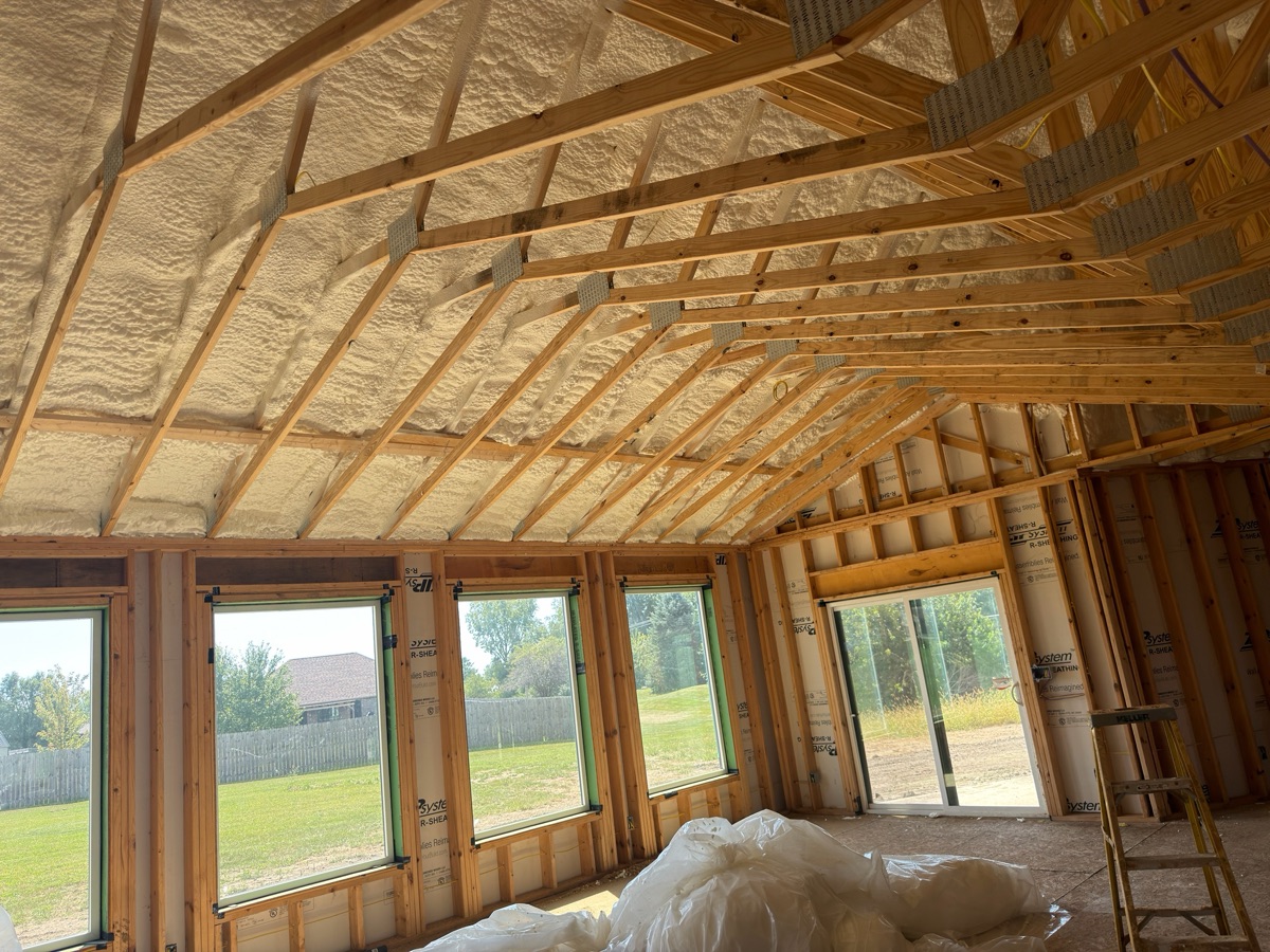 The roof line foamed the length of the house.